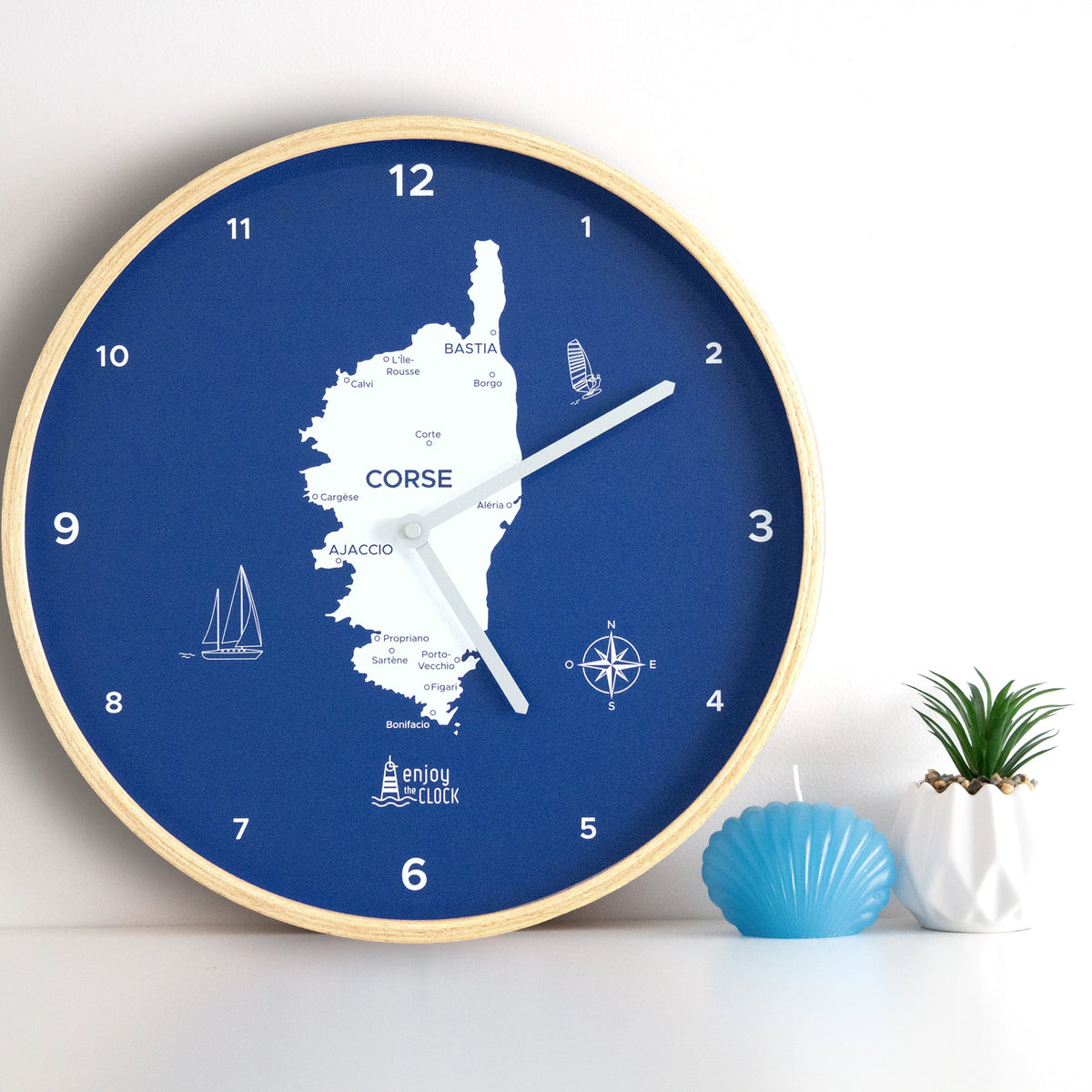 Horloge 12H Corse signée Enjoy the Clock®, décoration murale inspirée d’Ajaccio, Bastia et des paysages méditerranéens.